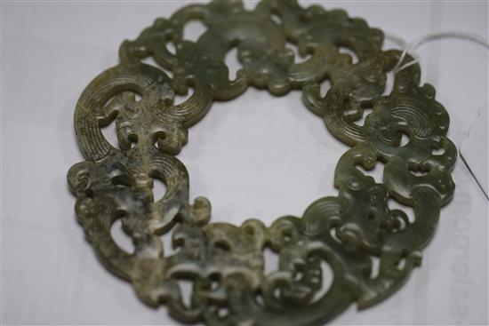 A Chinese archaistic celadon jade disc, D. 23.2cm